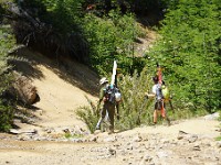 Pampa Linda to Puerto Frias 3-Day Trek ( Day 1 )  Skiers on their descent from Mount Tronador - lookind a bit out of place on the dusty road...